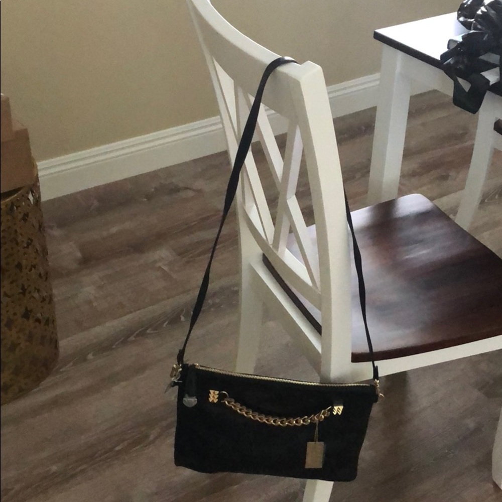 Black and gold Bebe purse